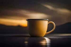 un amarillo café taza se sienta en un mesa en frente de un puesta de sol. generado por ai foto