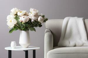 florero de blanco peonías con café mesa y Sillón cerca gris pared. generativo ai foto