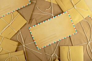 Christmas envelope mockup. Empty letter mock up on lots of craft envelopes and letters. photo