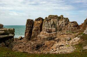 Enchanted Coastal Beauty Plougrescant's Gouffre d'Enfer, Brittany, France photo