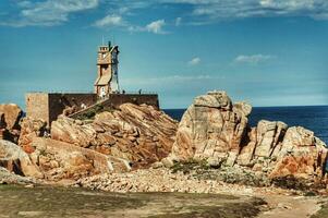 Serene Lighthouse on Brehat Island, Bretagne, France photo