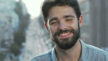 Cheerful handsome bearded man smiling to the camera video