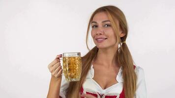 Gorgeous happy Bavarian woman enjoying smelling delicious beer video