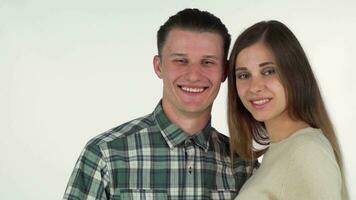 Happy young couple forming heart with their hands, smiling cheerfully video