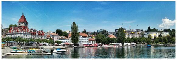 Serenity at Port Lausanne Lake, Buildings, Boats, and Reflection photo