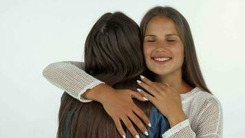 Lovely young woman smiling with eyes closed, embracing her best friend video