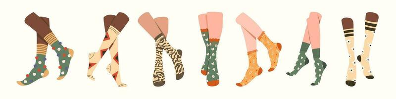 Pairs of feet in socks set. vector