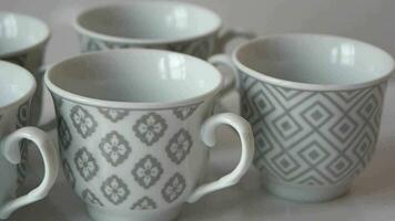 white ceramic empty tea cup on table . video