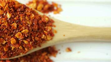 chili flakes in a bowl on table video