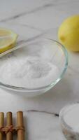 Baking soda and whole lemon on table video