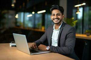 Manager sitting happy looking happiness success smile businessman males office men laptop indian technology photo