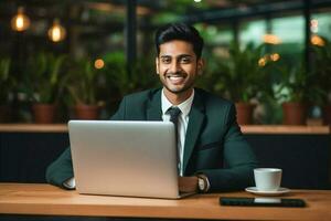 Cheerful smile success handsome happy laptop businessman office technology men indian computer modern males sitting photo