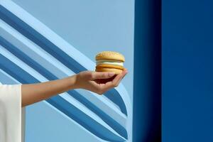 Woman hungry meal background food yellow fast concept art hamburger meat blue burger hand photo