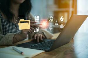 Big data clouds computing database, document management system, business woman use digital pen point folder and goal document icon software network, searching manage files online document database. photo