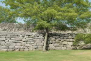 Stone rock wall with a tree background. AI Generative Pro Photo