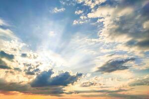 Beautiful dramatic sky opens with rain clouds and soft sunlight reveals blue gradient of atmosphere. Background photos of nature before sunset in autumn give feeling of calm, freedom, and hope again.