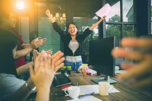 asian woman freelance happiness emotion successful project in home office photo