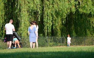 Most Beautiful Image of People Walking and Enjoying Summer Day at Wardown Public Park of Luton city, England United Kingdom, UK. June 16th, 2023 photo