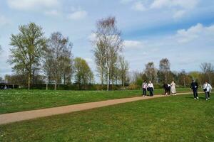 Beautiful view of People Walking and Visiting the Willen Lake of Milton Keynes City of England UK, Image Captured on April 9th, 2023 photo