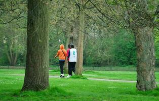 Most Beautiful Image of People Walking and Enjoying Summer Day at Wardown Public Park of Luton city, England United Kingdom, UK. April 27th, 2023 photo