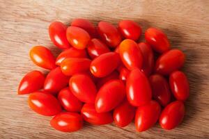 Cherry Tomato on wood photo