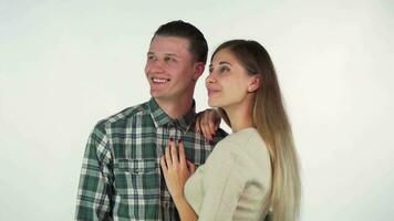 Lovely happy couple embracing, looking away dreamily together video