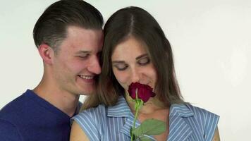 Gorgeous woman smelling the rose her boyfriend giving her video