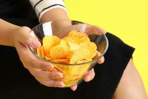 Hand with Potato Chips photo