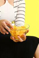 Hand with Potato Chips photo