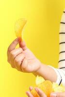 Hand with Potato Chips photo