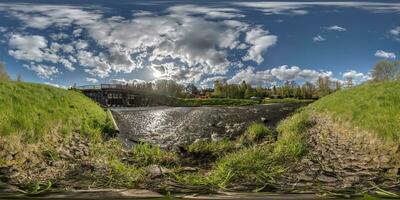 full seamless spherical hdri 360 panorama view near dam lock sluice on lake impetuous waterfall with beautiful clouds in equirectangular projection, VR content photo