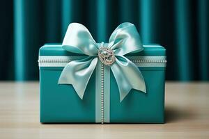 Blue gift box on a wooden table. Engagement, marriage proposal. photo