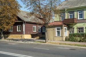 example of hundred-year-old historical old wooden building and homestead of private sector in wooden constructivism style photo