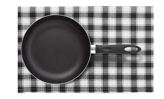 Frying pan on napkin isolated. Top view mockup. photo