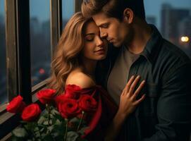young guy and woman hug while holding roses on the balcony of the city photo