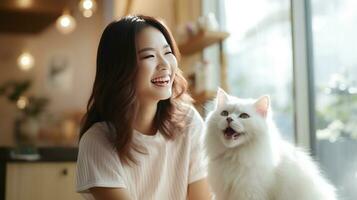 Fluffy white cat enjoying a grooming session with a smiling owner. photo