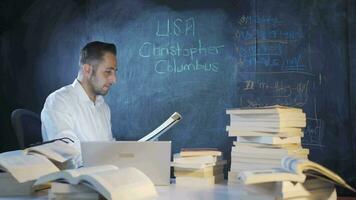 The historian man writing Christopher Columbus on the blackboard. video