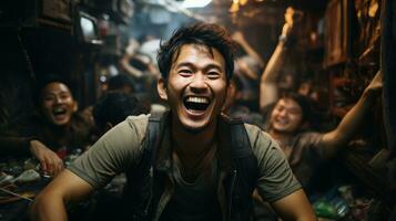 Portrait of a drunk asian man laughing in mess room with friends. photo