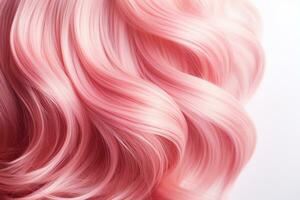 Pink hair close-up. Women's long pink hair. Beautiful styling of wavy shiny curls. Hair coloring. Hairdressing treatments photo