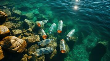 Plastic bottles floating on the sea. Plastic waste in the water. photo