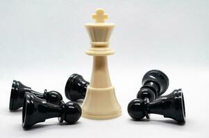 White king defeated black pawns. Strategy and battle concept photo