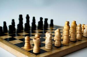 Battle between white and black chess on a chess boar. Strategy and tactics concept photo