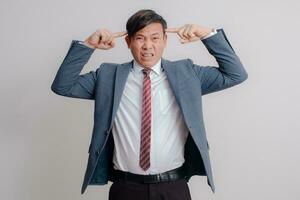 Businessman in a suit showing a stressed expression photo