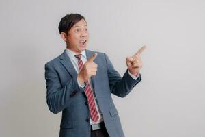 Businessman wearing a suit on a white background photo