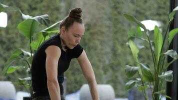 a woman is doing yoga in front of a window video