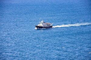 sea landscape on a sunny day with blue sky and water and a sailing ship photo