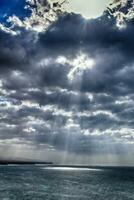 landscape of the Canary Island Fueratentra on the rocks and the ocean and the sky with clouds in January photo