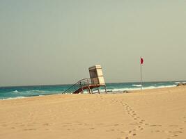 landscape from the Spanish Canary Island Fuerteventura with dunes and the ocean photo