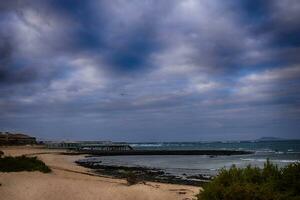 view of the beach and blue ocean on the Canary Island Fuerteventura in Spain photo