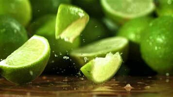 Lime pieces fall on the wet table. Filmed on a highspeed camera at 1000 fps. High quality FullHD footage video